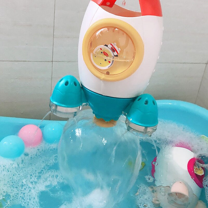 Tên lửa tự động xoay nhả nước đồ chơi em bé tắm